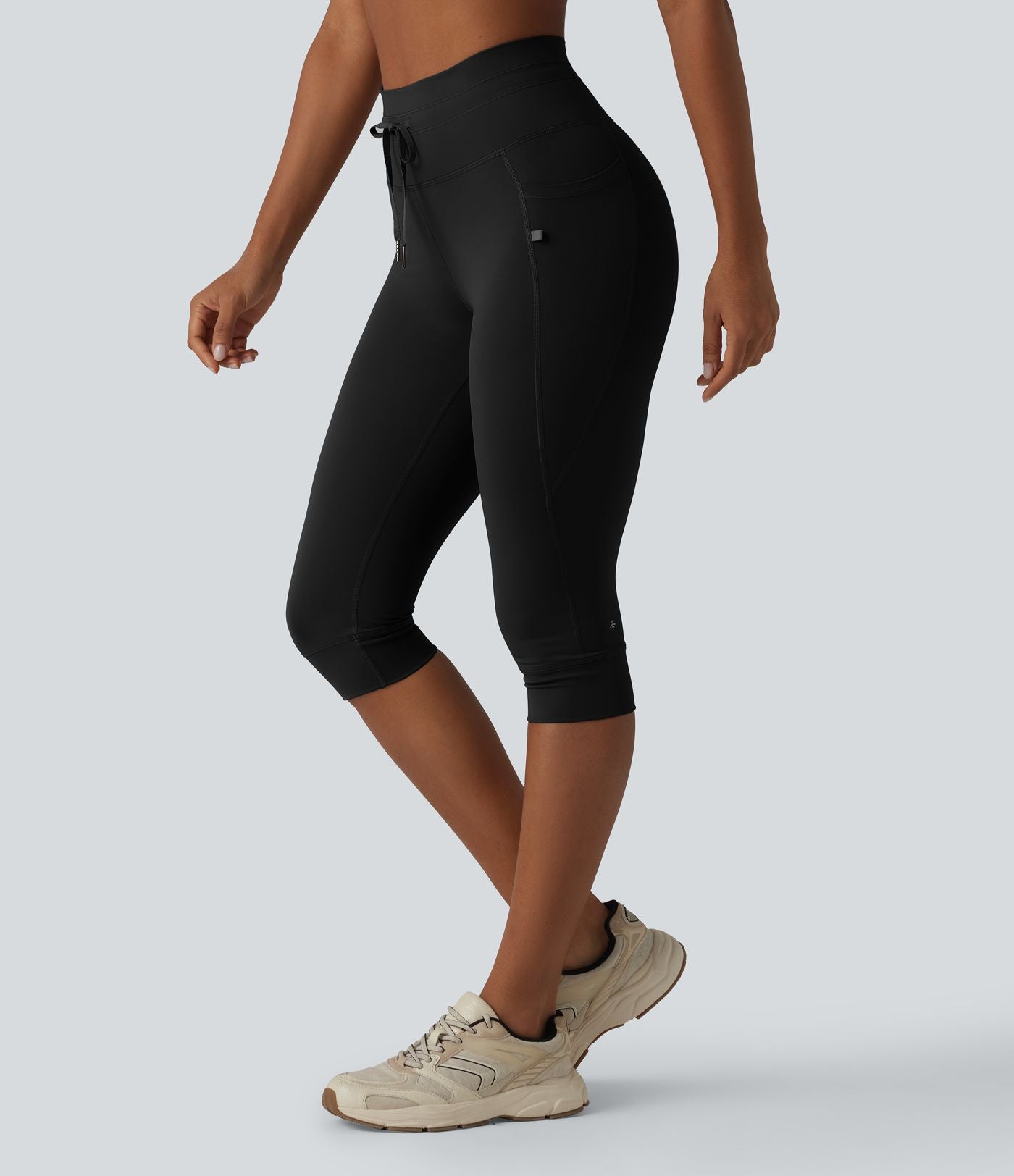 Legging yoga uni corsaire taille haute avec cordon de serrage et poches