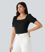 Blouse habillée col carré à manches bouffantes et tissu texturé