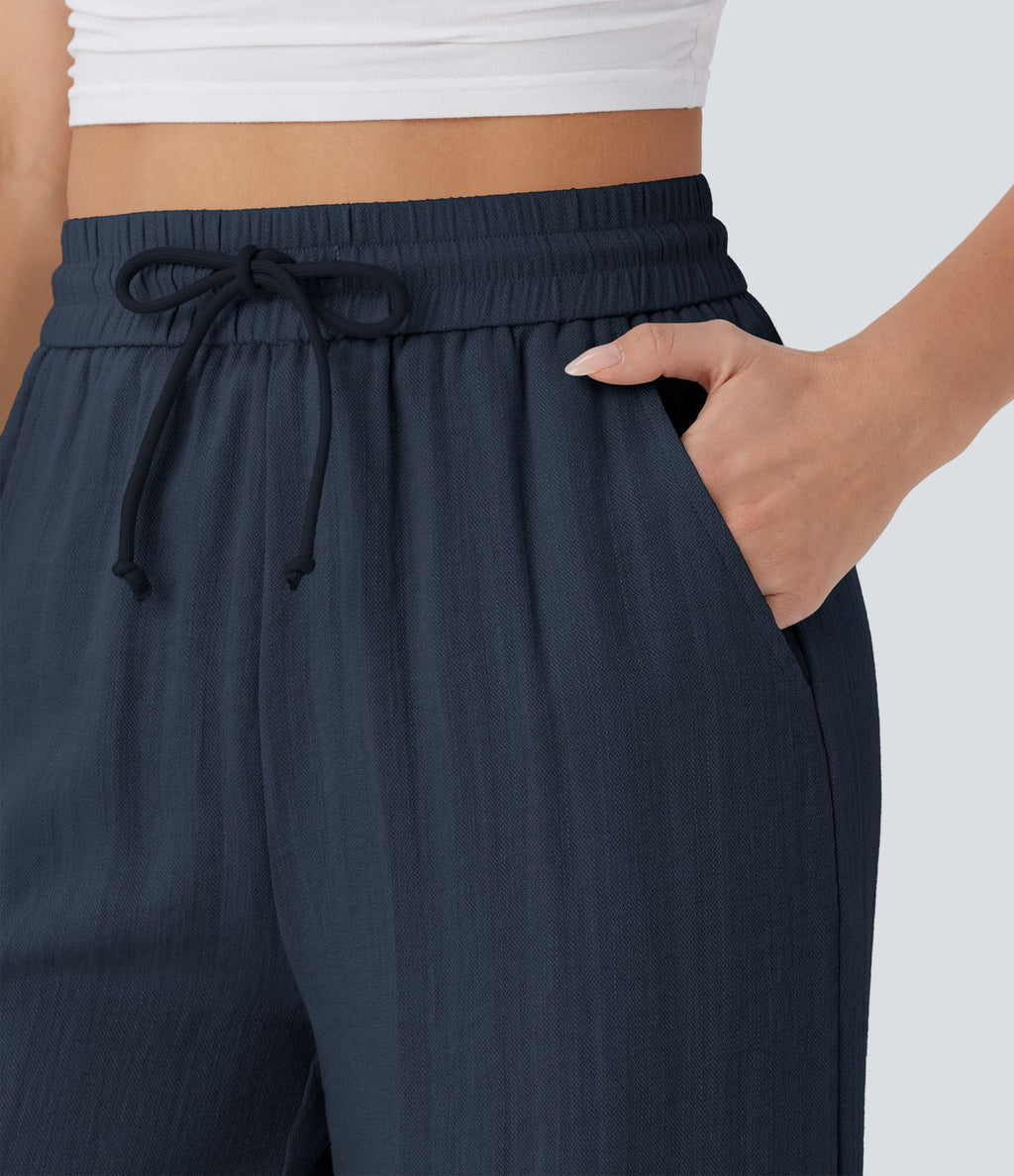 Pantalon large fluide taille haute avec cordon de serrage, poches latérales et aspect lin
