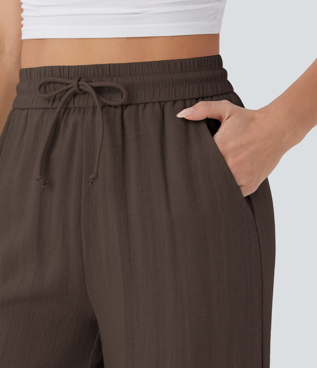 Pantalon large fluide taille haute avec cordon de serrage, poches latérales et aspect lin