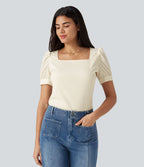 Blouse habillée col carré à manches bouffantes et tissu texturé