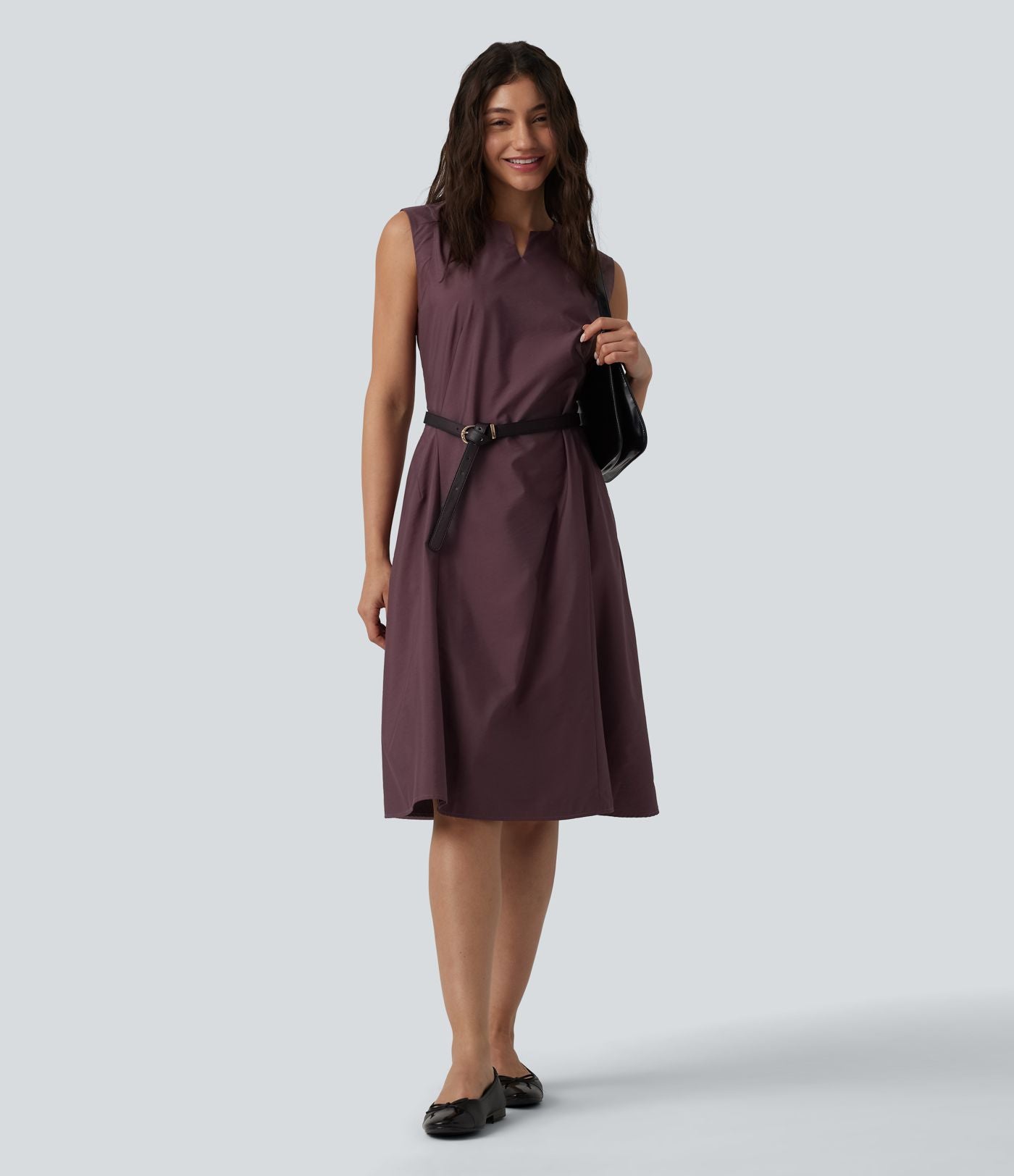 Robe mi-longue évasée de travail col cranté sans manches avec poches