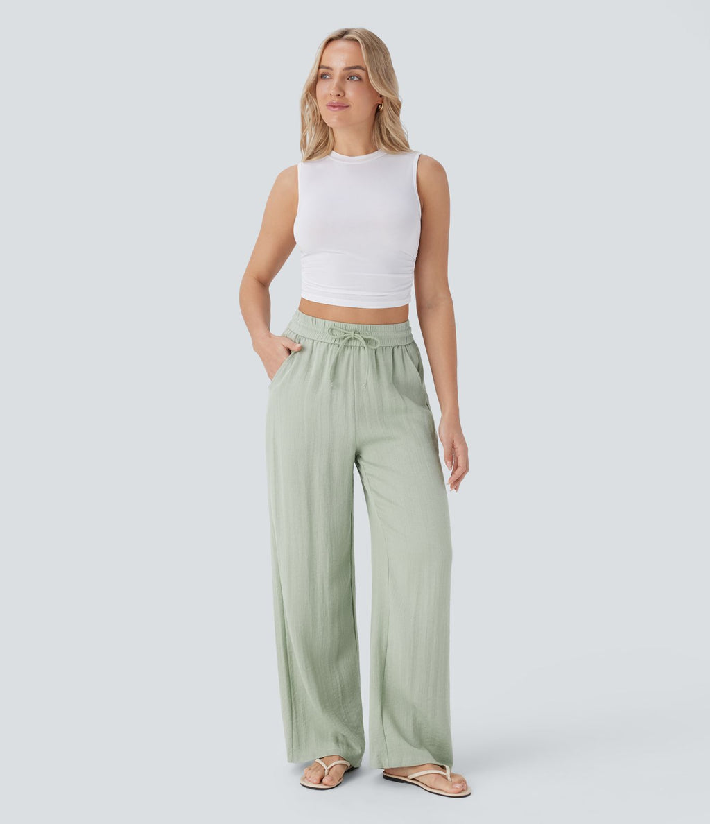Pantalon large fluide taille haute avec cordon de serrage, poches latérales et aspect lin