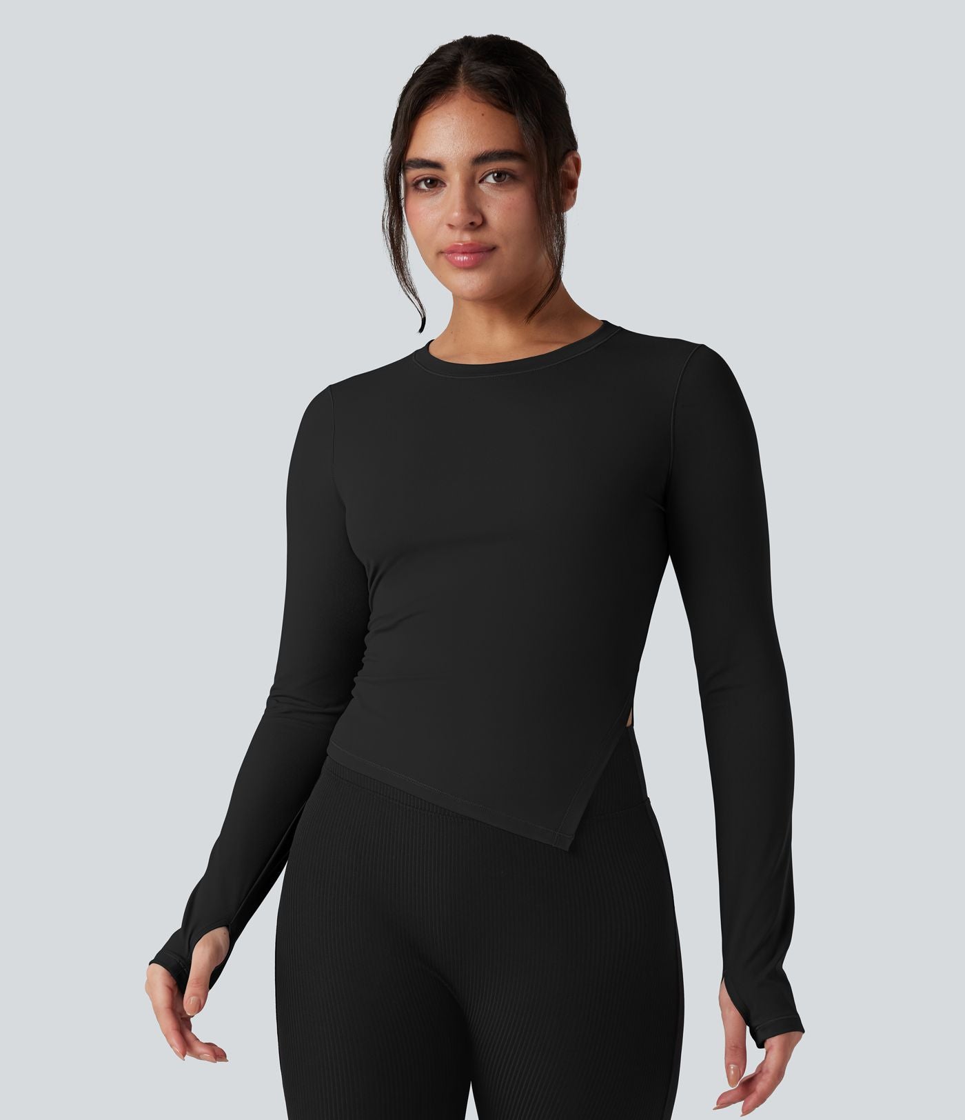 Top de sport yoga col rond ourlet asymétrique fendu manches longues avec trous pouces