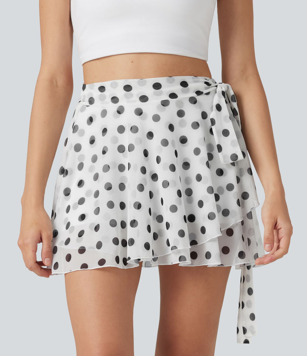 Jupe évasée micro-mini en maille à pois, taille haute, à nouer sur le côté et poche