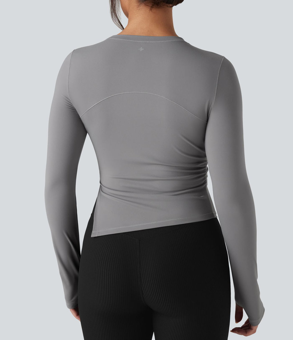 Top de sport yoga col rond ourlet asymétrique fendu manches longues avec trous pouces