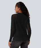 Pull ajouré demi-zip col rond manches longues