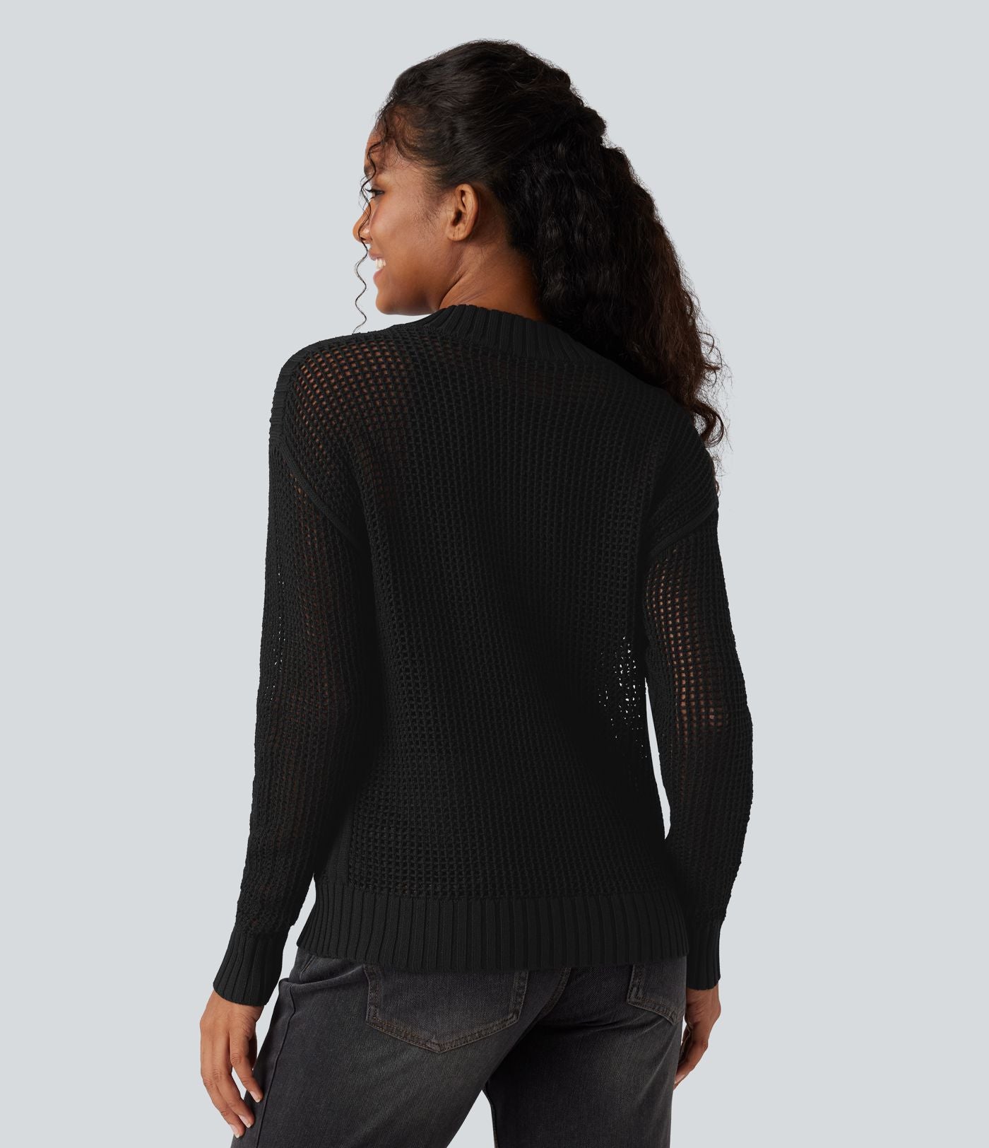 Pull ajouré demi-zip col rond manches longues