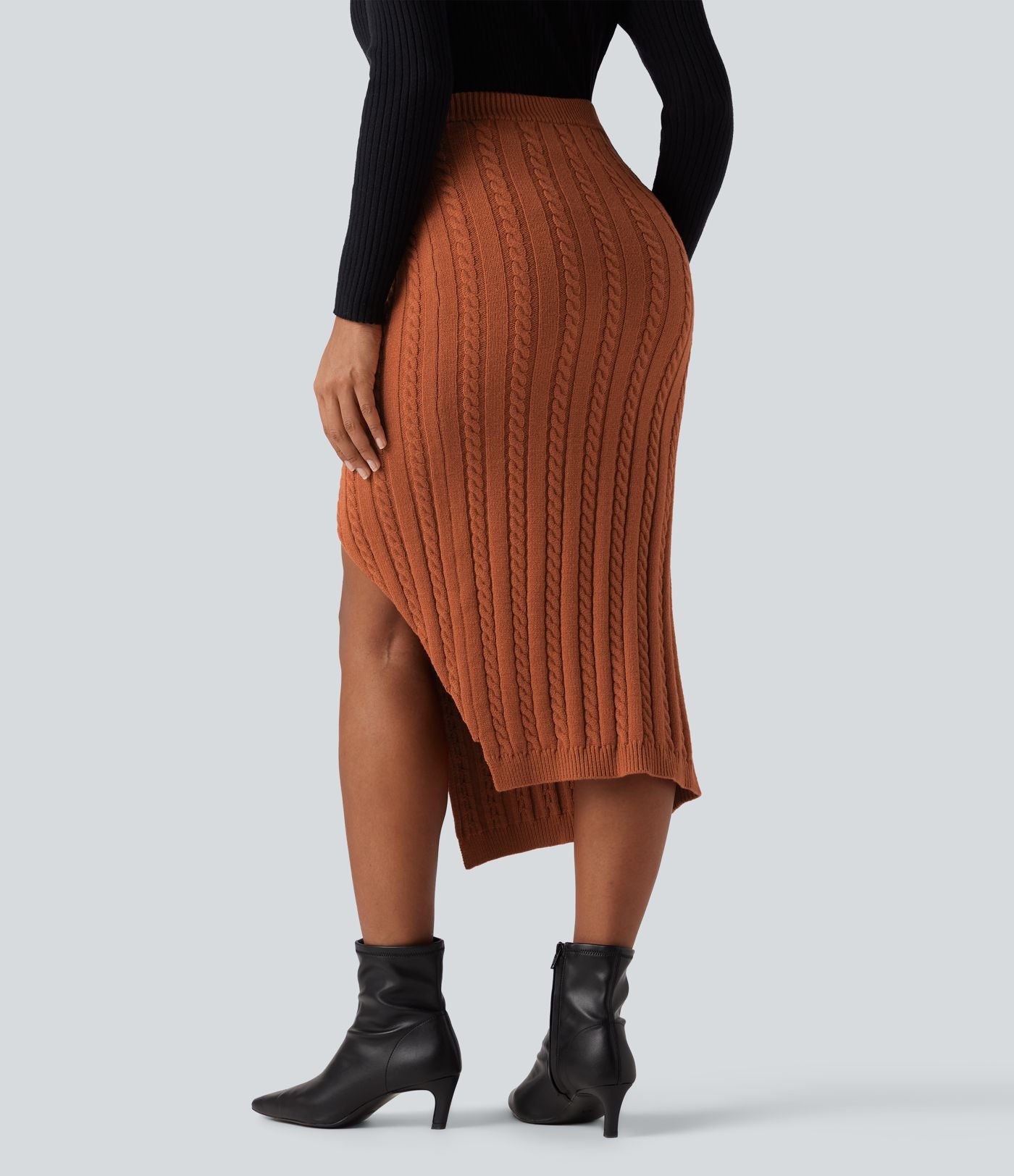 Jupe pull moulante mi-longue taille haute en maille torsadée avec fente