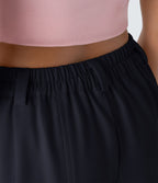 Pantalon tailleur ample, taille moyenne, coupe barrel, à poches