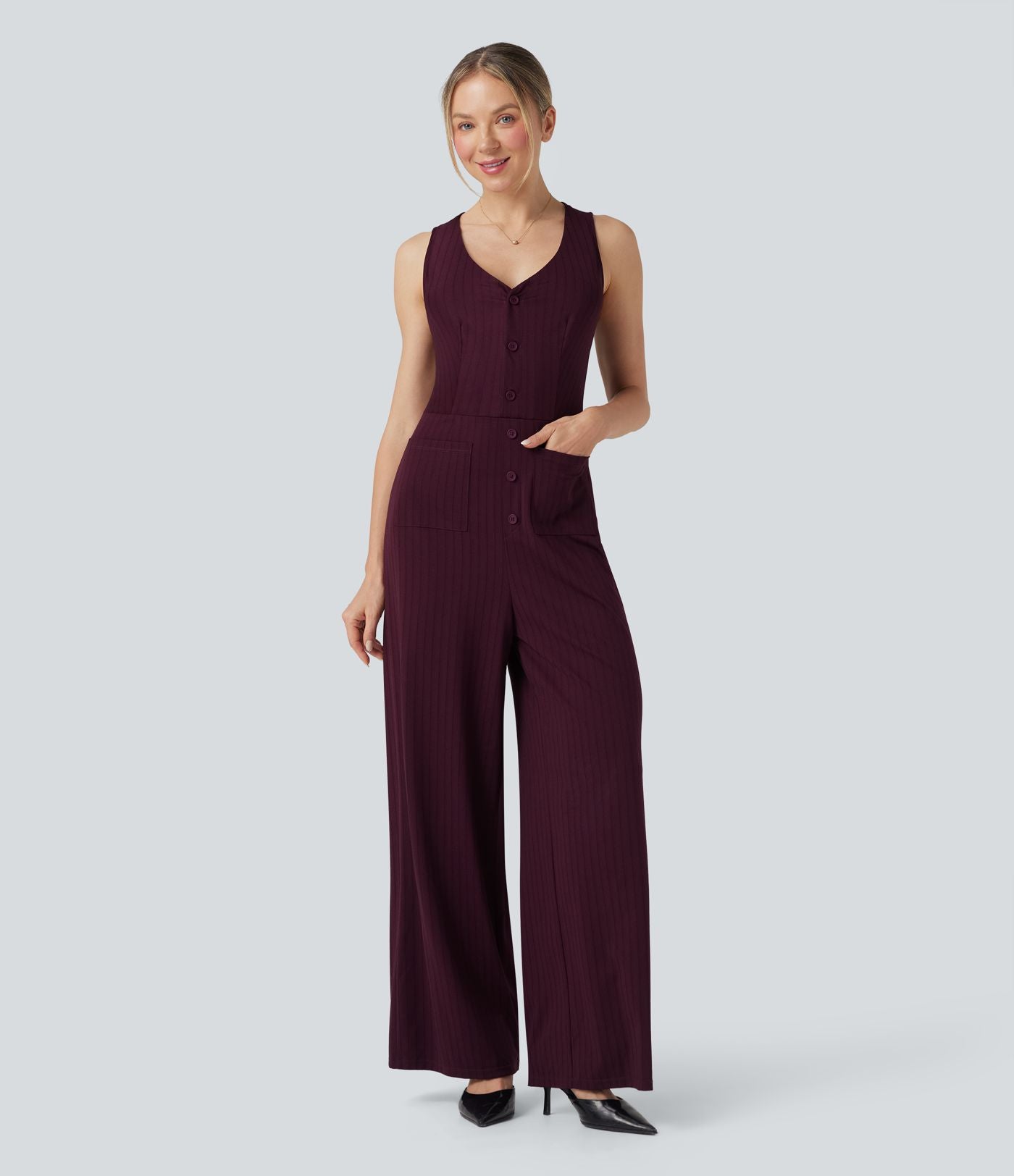 Combinaison tailleur rayée à jambes larges, décolleté en V, découpe et poches