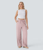 Pantalon large fluide taille haute avec cordon de serrage, poches latérales et aspect lin