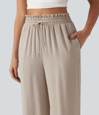 Pantalon effet lin taille haute avec cordon de serrage, bord volanté et poches