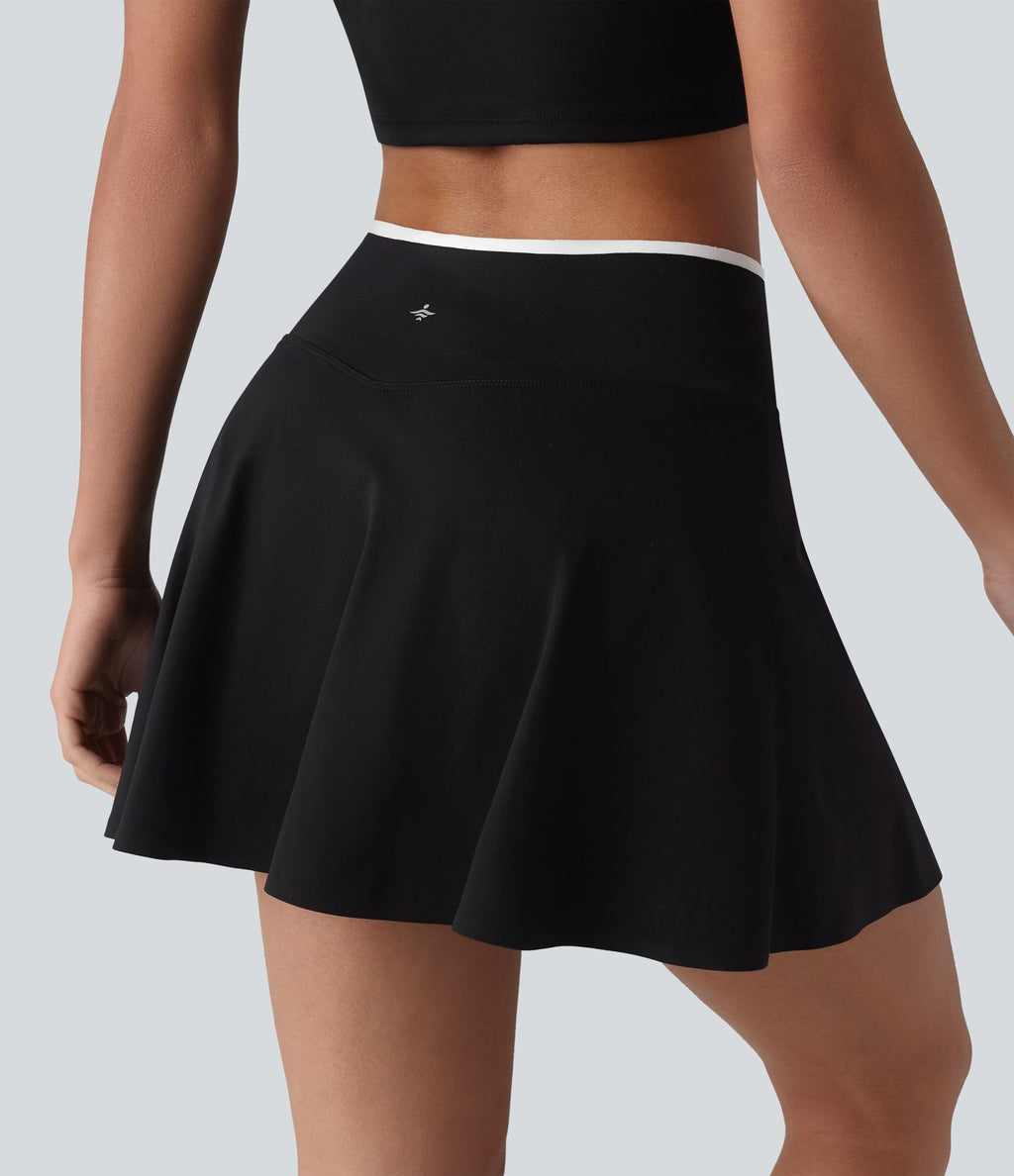 Jupe de tennis mini 2-en-1 color block croisée taille mi-haute avec poches