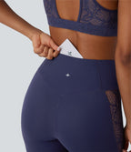 Legging de yoga Softlyzero™ taille haute avec design croisé, dentelle contrastée, sous-vêtement intégré, poche et protection UPF50+