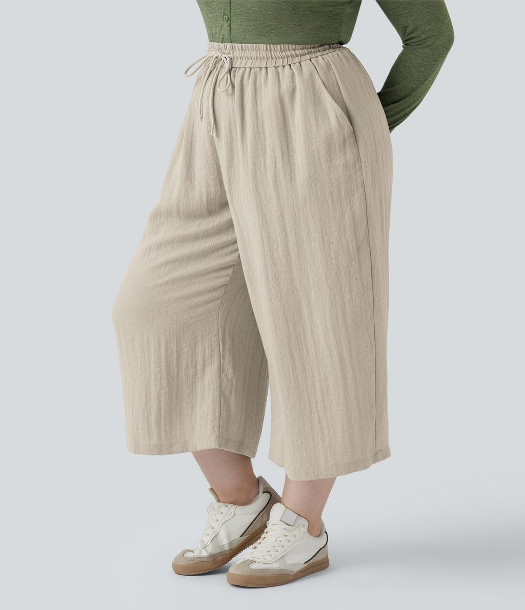 Pantalon grande taille large fluide taille haute avec cordon de serrage, poches et aspect lin