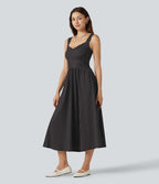 Robe fluide décontractée midi sans manches dos nu croisée à pois avec poches