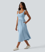 Robe midi fluide sans manches dos croisé, avec brassière intégrée (Bonnets E-G) et poches