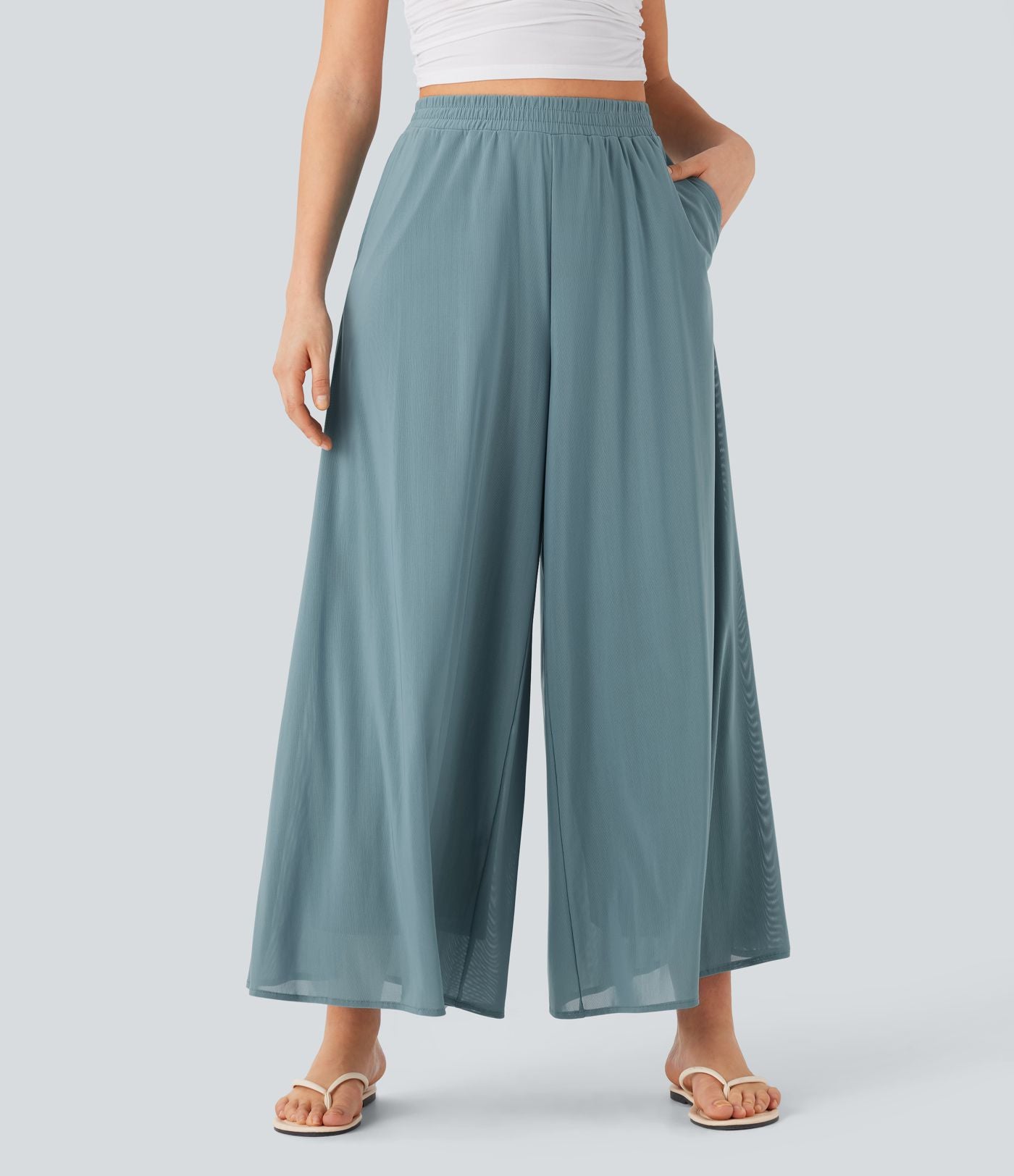 Pantalon fluide et ample avec superposition en mesh, poches latérales et taille haute
