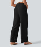 Pantalon effet lin taille haute avec cordon de serrage, bord volanté et poches