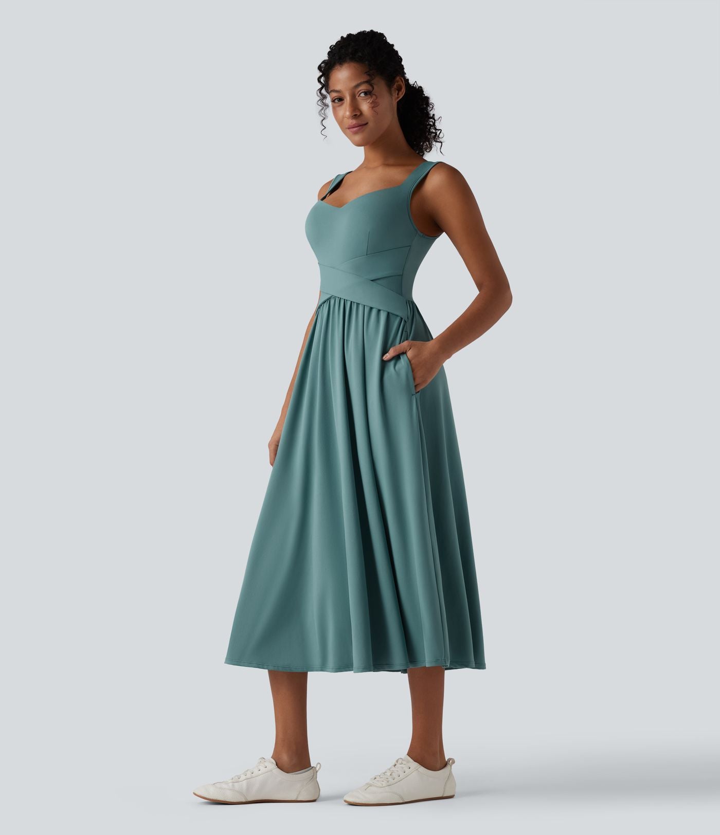 Robe midi fluide sans manches dos croisé ouvert avec poches