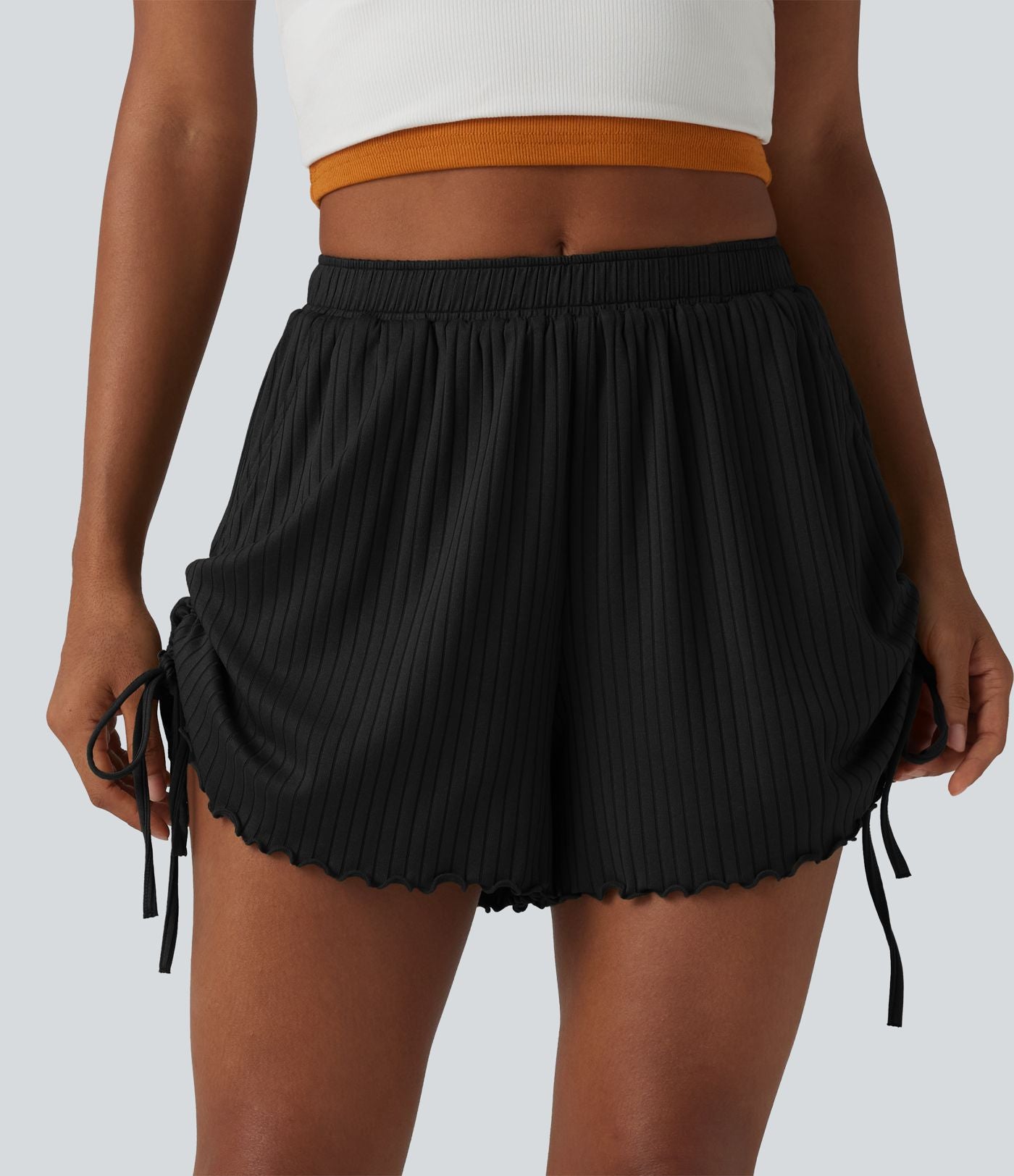 Short en maille côtelée taille mi-haute à cordon de serrage et ourlet ondulé 10 cm avec poches
