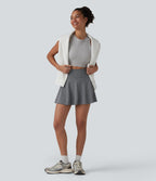 Jupe de sport mini gainante 2-en-1 taille haute à rayures avec poches