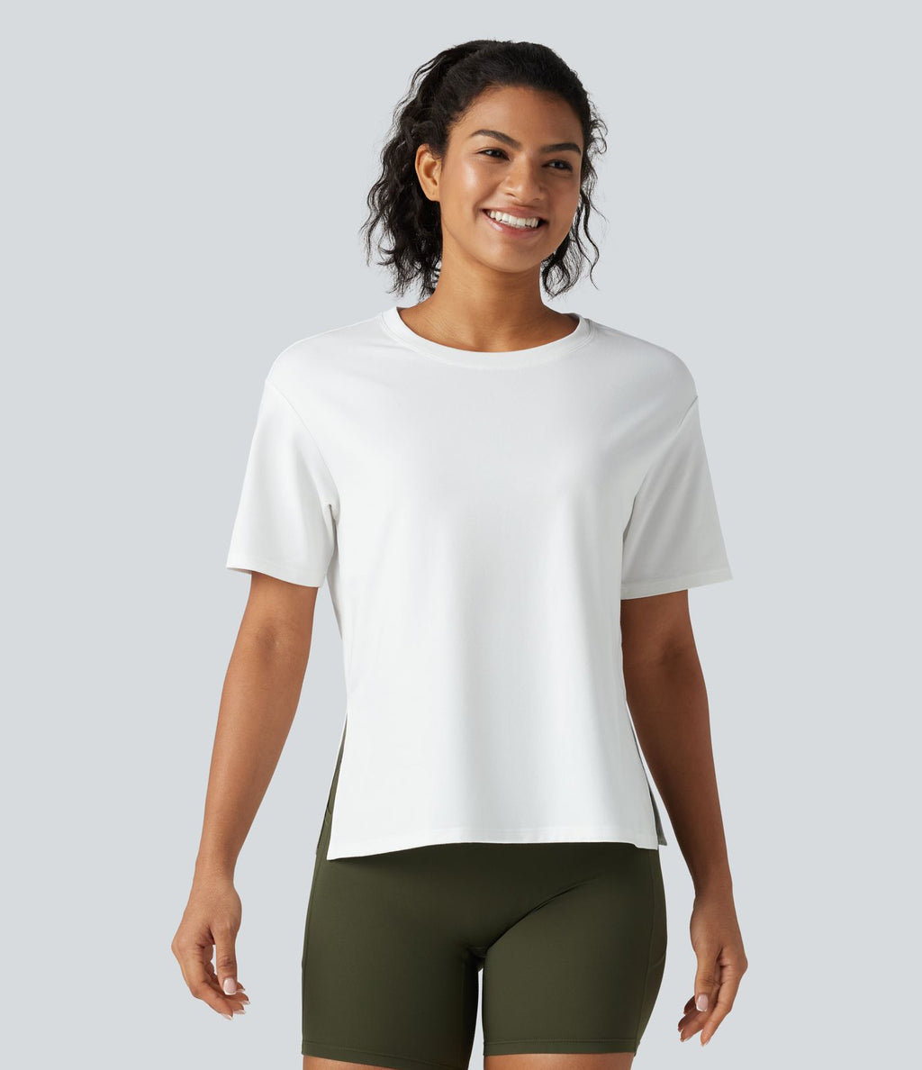 Haut de sport en coton col rond à manches courtes, ourlet fendu et coupe ample pour le yoga