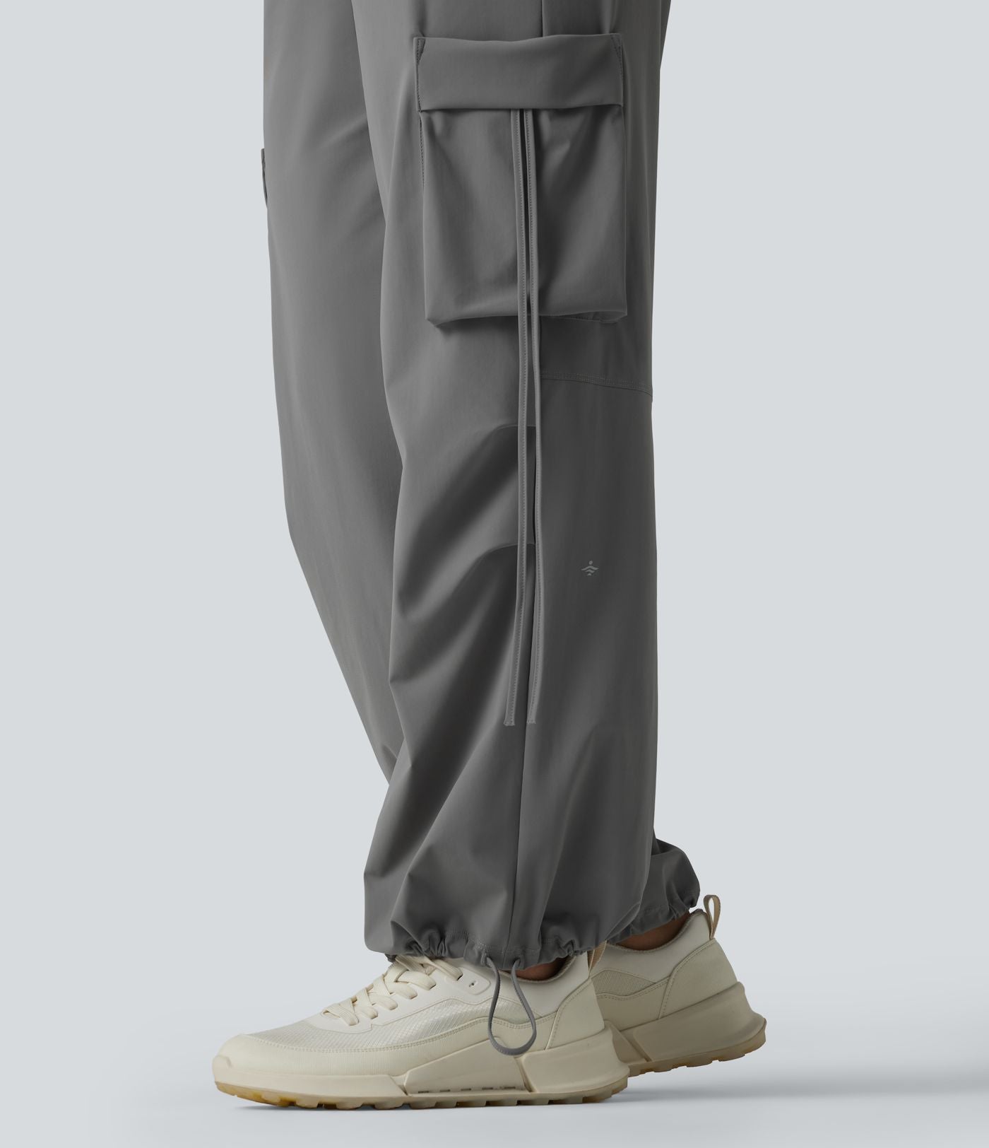 Pantalon cargo large fluide d'entraînement taille haute avec cordon de serrage, séchage rapide, à effet frais InstantCool et poches, protection solaire UPF40+