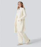 Robe d'intérieur longue tricot ouverte ceinturée manches longues avec poches
