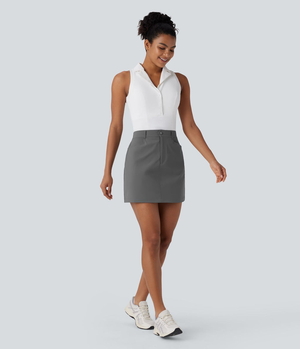 Jupe courte de golf ligne A taille haute avec boutons, zip, poches latérales et fente