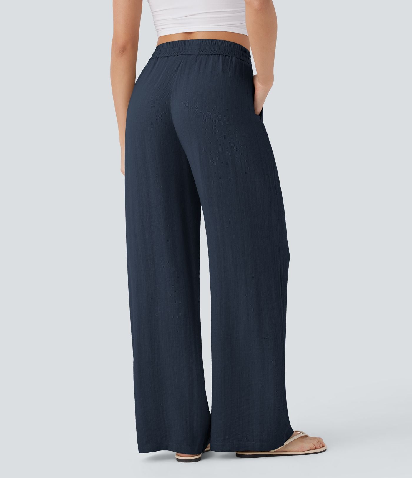 Pantalon large fluide taille haute avec cordon de serrage, poches latérales et aspect lin