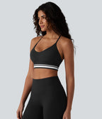 Brassière de sport SoftlyZero™ Plush à maintien léger, dos croisé ouvert, rayures color block et soutien intégré