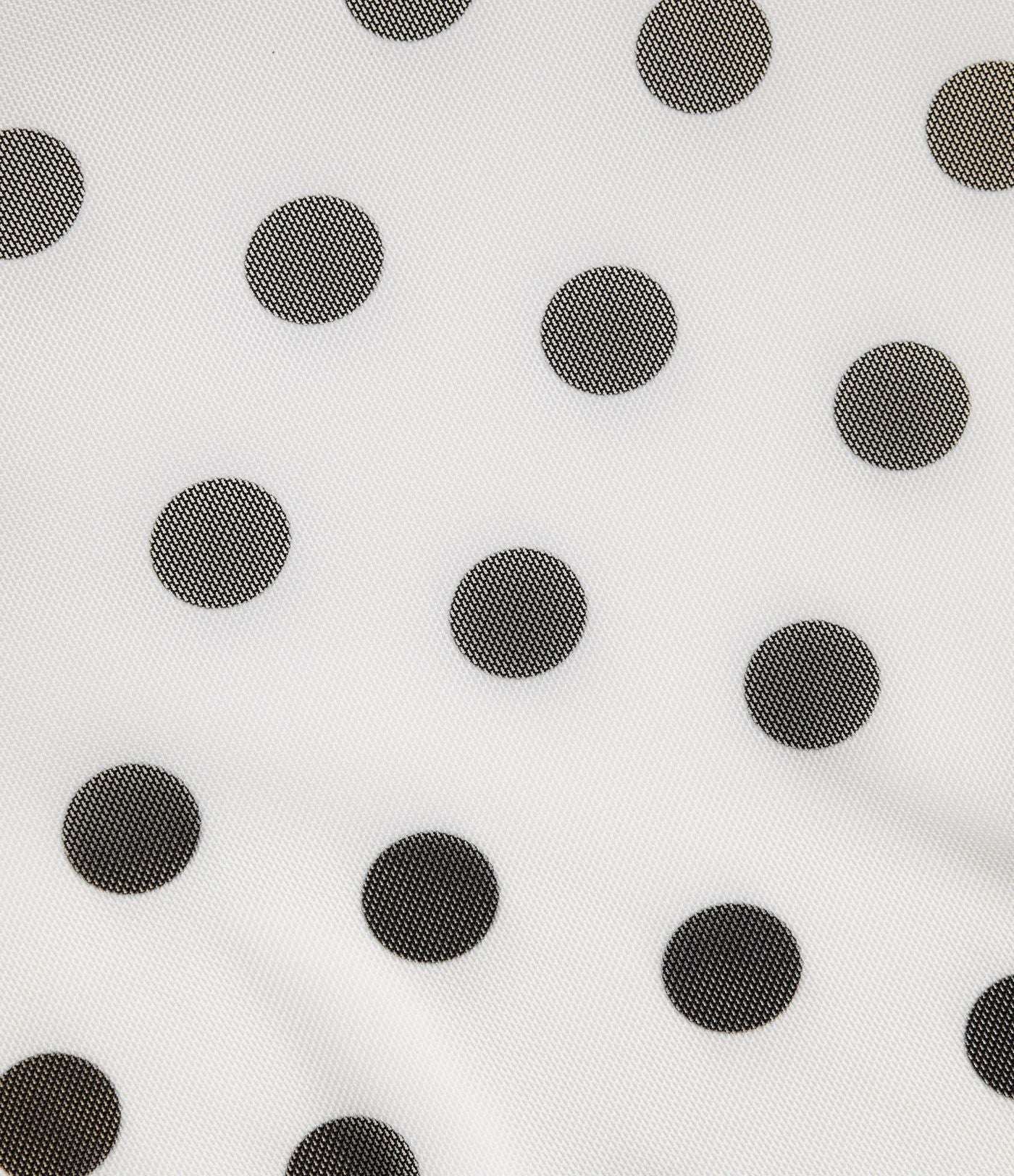 Jupe évasée micro-mini en maille à pois, taille haute, à nouer sur le côté et poche