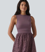 Robe midi de villégiature sans manches col rond à broderie anglaise, avec poches