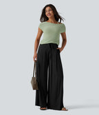 Pantalon large fluide taille mi-haute aspect lin avec ceinture et poches