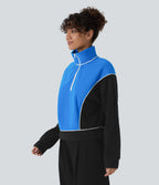 Sweat bicolore en polaire col montant avec demi-zip et manches longues