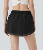 Mini-jupe de tennis 2-en-1 taille moyenne avec cordon de serrage, filet contrasté et poches latérales