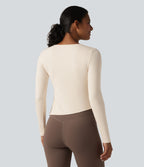 Halara HeatCore Haut de sport chauffant col rond manches longues ourlet asymétrique