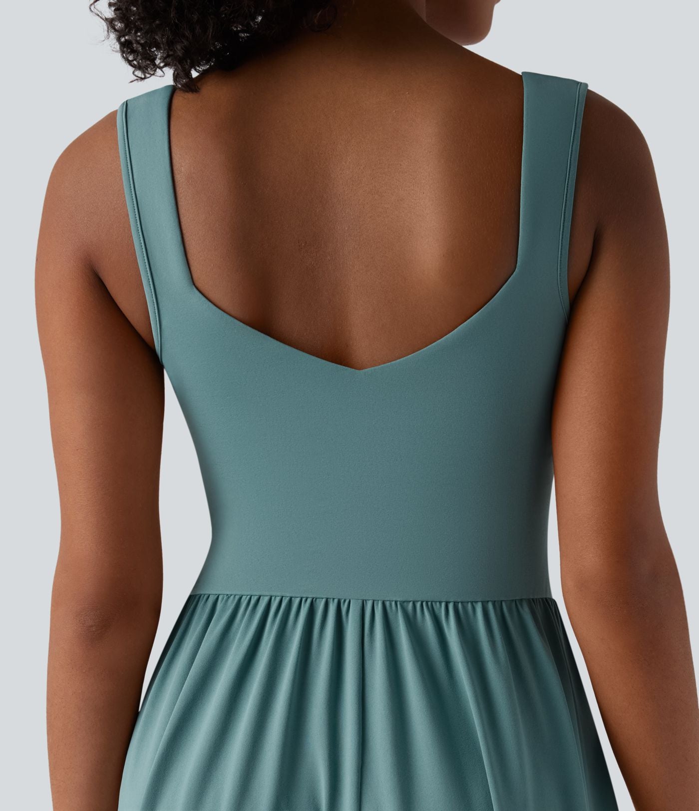 Robe midi fluide sans manches dos croisé ouvert avec poches