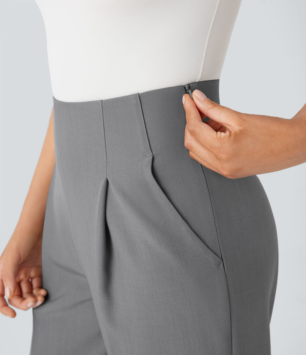 Pantalon tailleur taille haute froncé coupe fuselée avec poches et fermeture éclair invisible sur le côté