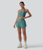 Short yoga 2-en-1 gainant taille haute à pois réfléchissants, ourlet arrondi croisé et œillets avec poches