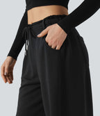Pantalon jogging large taille mi-haute finition brute avec cordon de serrage et poches
