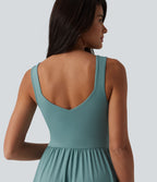 Robe midi fluide sans manches dos croisé, avec brassière intégrée (Bonnets E-G) et poches