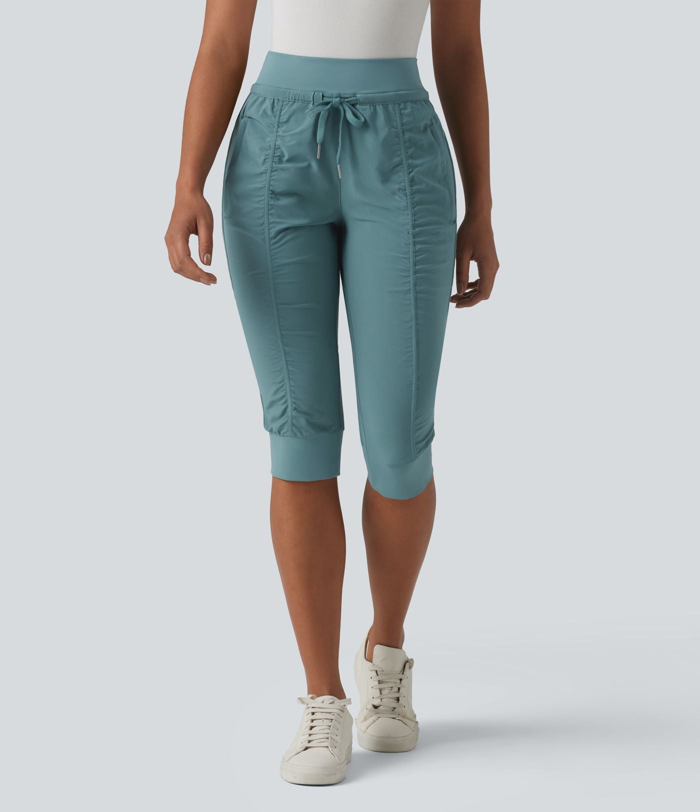 Jogging fuselé taille haute avec cordon de serrage et poches zippées