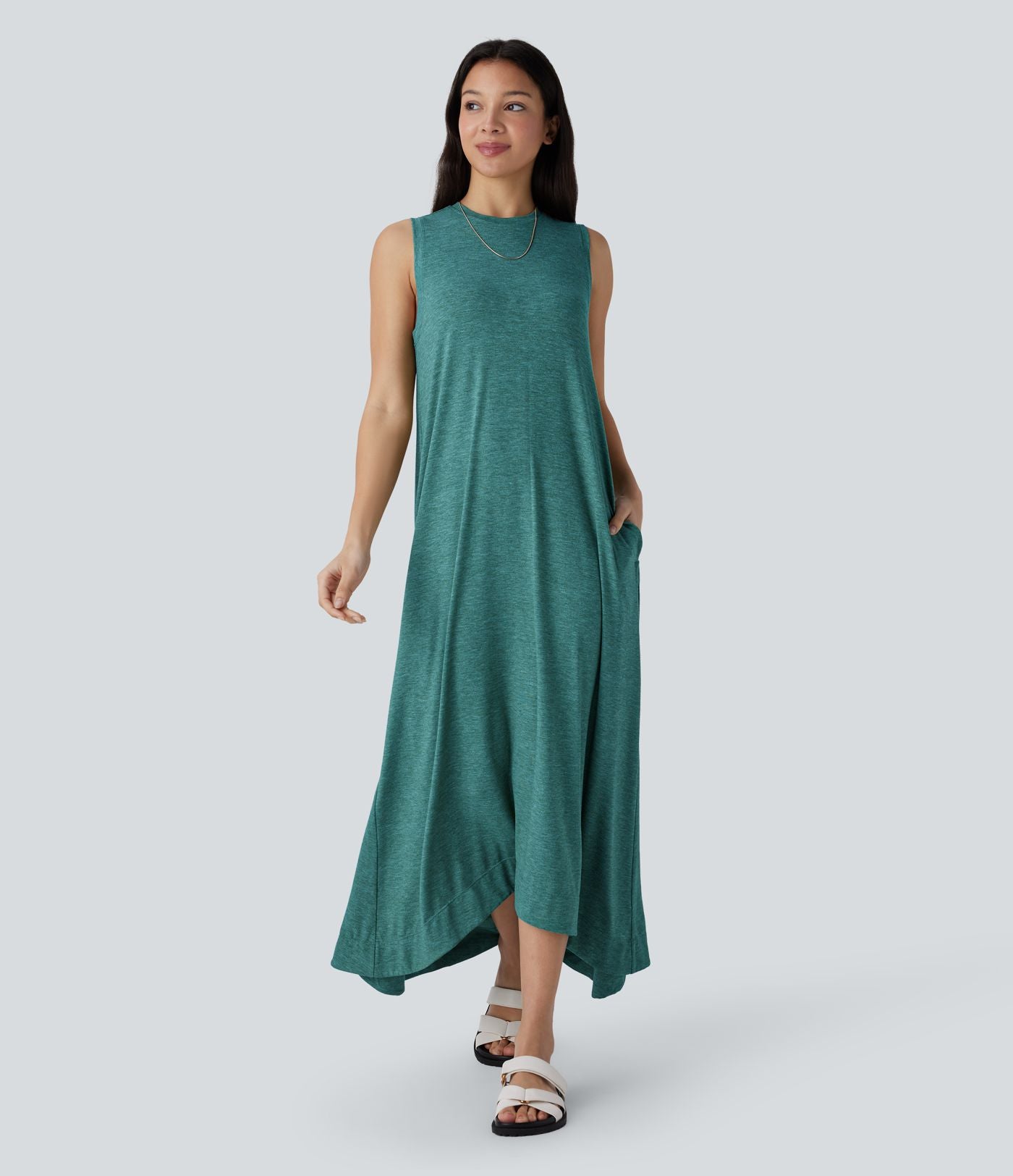 Robe longue décontractée fluide à col rond, sans manches, poches latérales et ourlet asymétrique