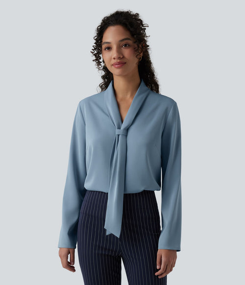 Blouse esprit bureau défroissage facile, col V, manches longues et lien à nouer