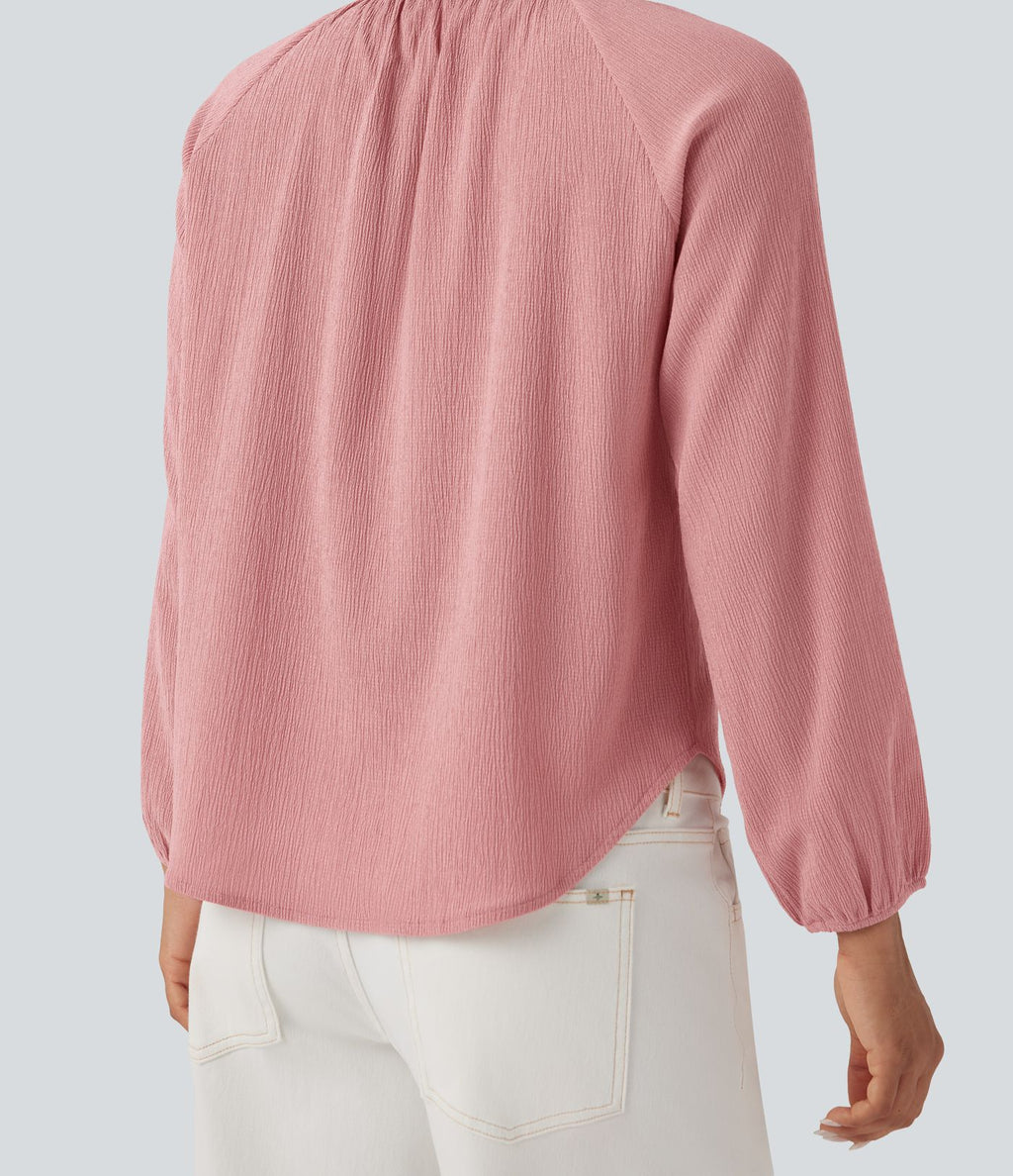 Blouse texturée col rond manches longues ourlet arrondi