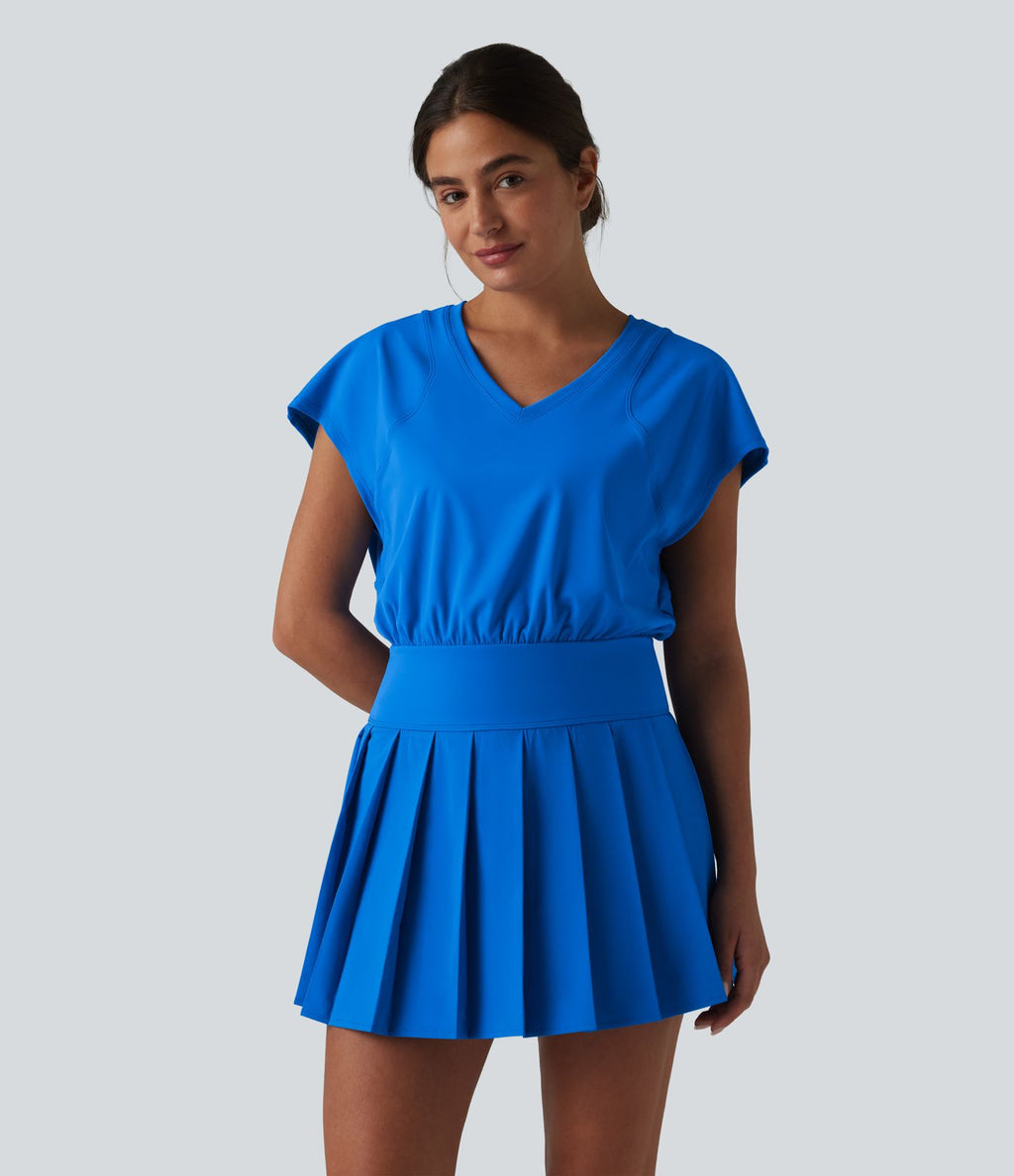 Robe sport de tennis mini 2-en-1 à col V, manches courtes et ourlet plissé avec fermeture éclair invisible et poches