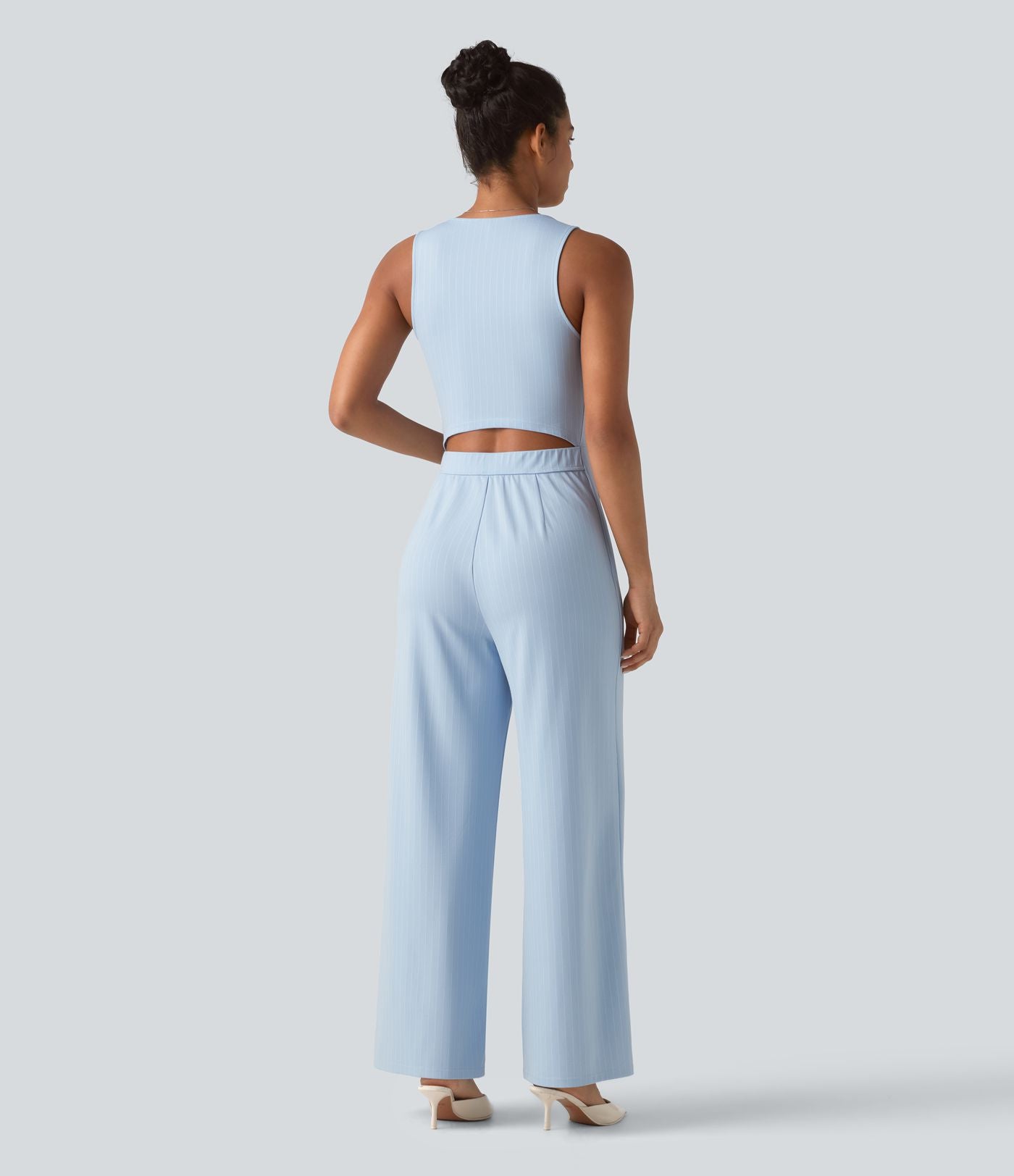 Combinaison tailleur rayée à jambes larges, décolleté en V, découpe et poches